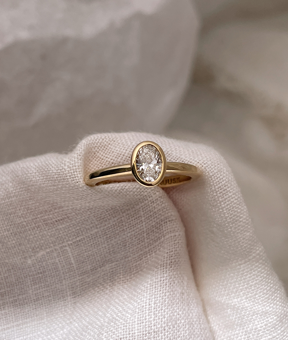 Hand carved bezel set Solitaire ring, cast in solid Gold. Handcrafted to order in Sydney Australia. Minimal Diamond Engagement ring ideal for stacking with other bands. Custom engagement and wedding rings.