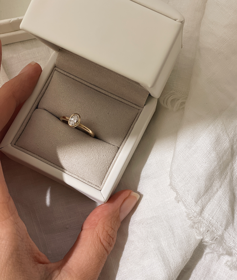 Hand carved bezel set Solitaire ring, cast in solid Gold. Handcrafted to order in Sydney Australia. Minimal Diamond Engagement ring ideal for stacking with other bands. Custom engagement and wedding rings.