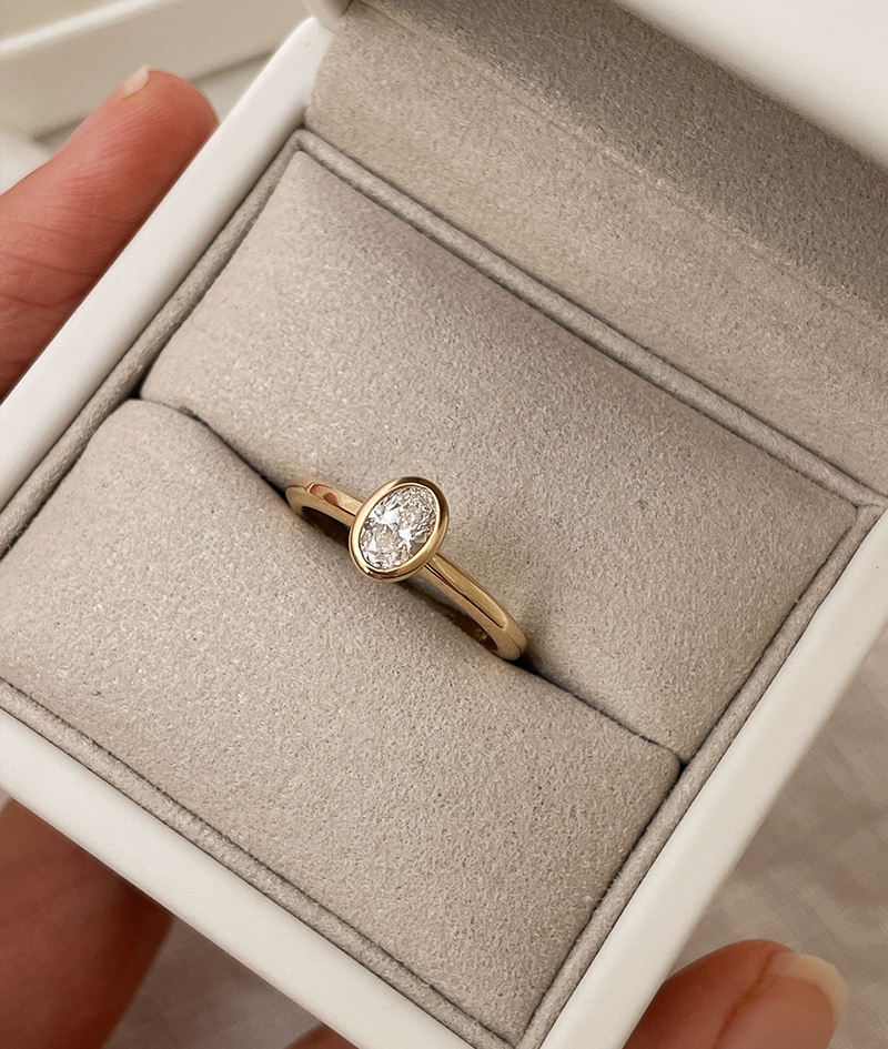 Hand carved bezel set Solitaire ring, cast in solid Gold. Handcrafted to order in Sydney Australia. Minimal Diamond Engagement ring ideal for stacking with other bands. Custom engagement and wedding rings.