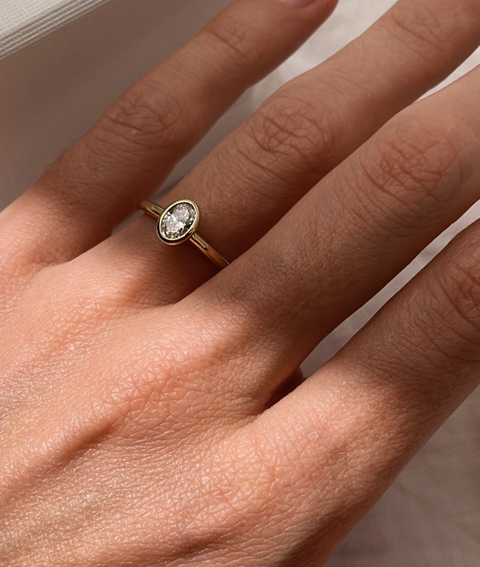 Hand carved bezel set Solitaire ring, cast in solid Gold. Handcrafted to order in Sydney Australia. Minimal Diamond Engagement ring ideal for stacking with other bands. Custom engagement and wedding rings.