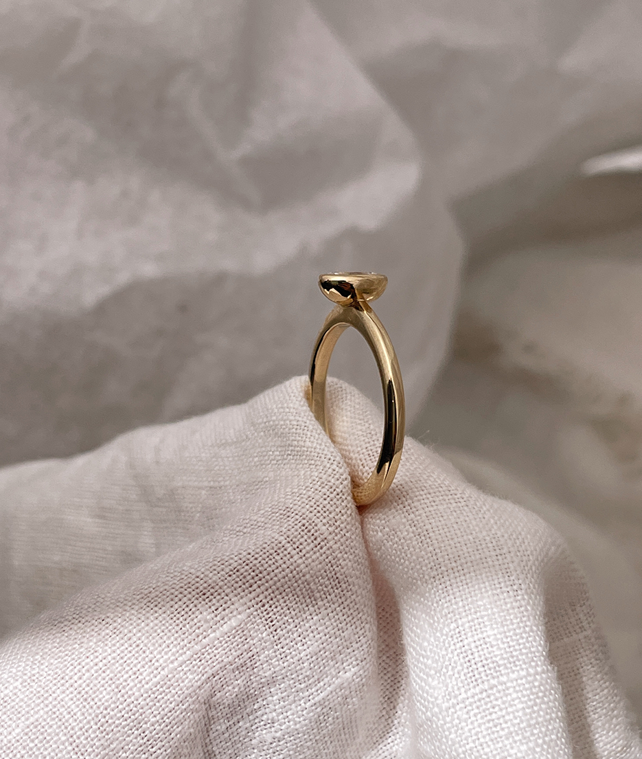 Hand carved bezel set Solitaire ring, cast in solid Gold. Handcrafted to order in Sydney Australia. Minimal Diamond Engagement ring ideal for stacking with other bands. Custom engagement and wedding rings.