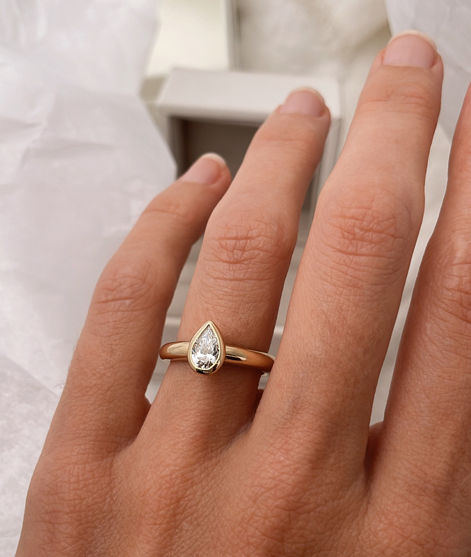 Hand carved bezel set Solitaire ring, cast in solid Gold. Handcrafted to order in Sydney Australia. Minimal Diamond Engagement ring ideal for stacking with other bands. Custom engagement and wedding rings.