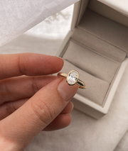 Hand carved oval bezel set Solitaire ring, cast in solid Gold. Handcrafted to order in Sydney Australia. Minimal Diamond Engagement ring ideal for stacking with other bands. Custom engagement and wedding rings.