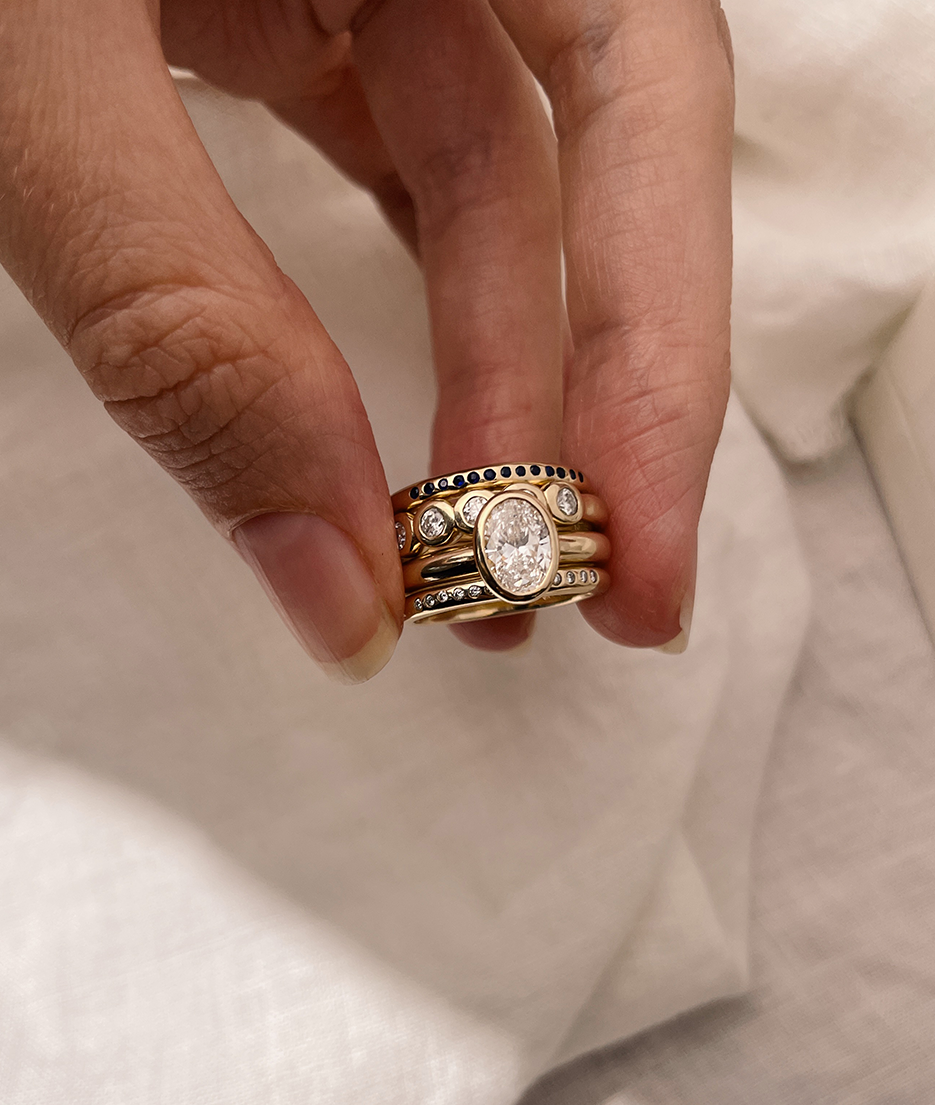Hand carved oval bezel set Solitaire ring, cast in solid Gold. Handcrafted to order in Sydney Australia. Minimal Diamond Engagement ring ideal for stacking with other bands. Custom engagement and wedding rings.