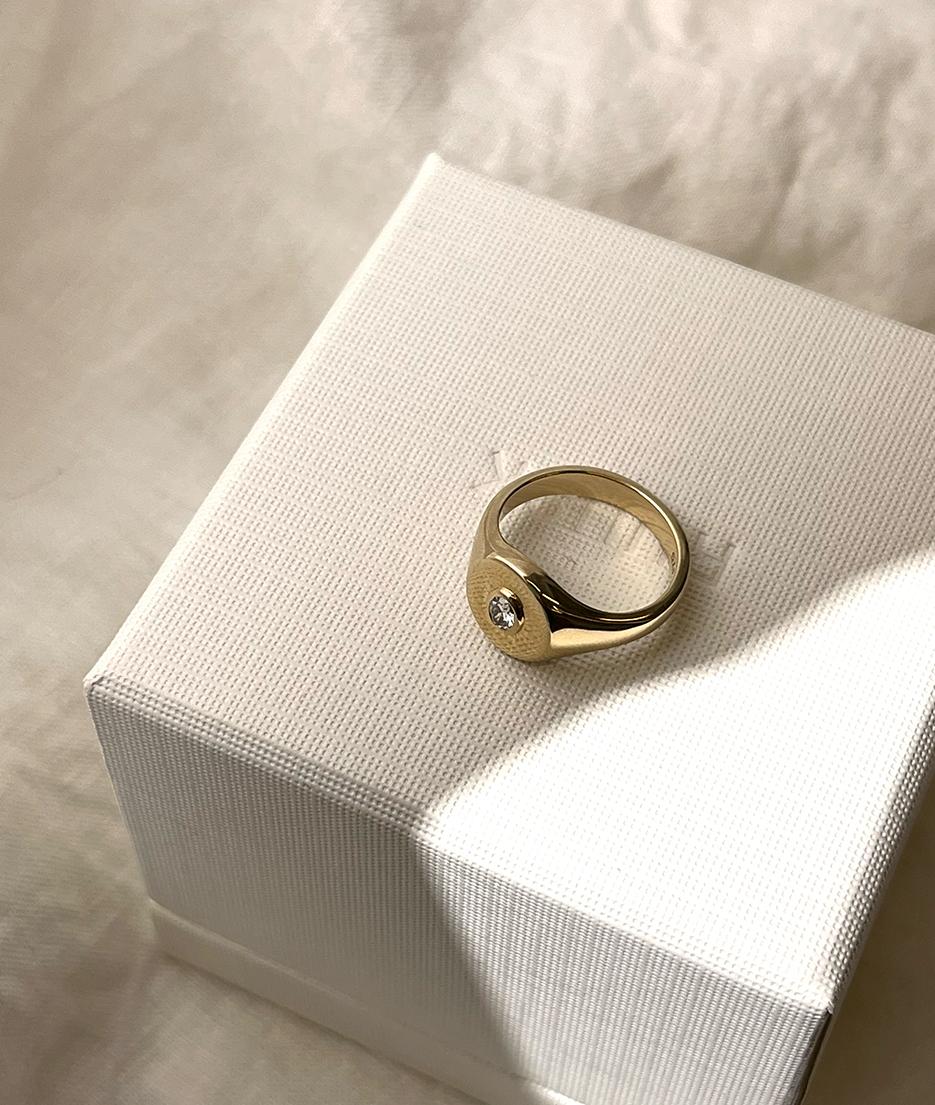 Oval Bezel-Set Small Signet Ring, cast in solid Gold. Handmade womens signet ring featuring a conflict-free Diamond. Made to order in Sydney Australia. Bespoke and Custom rings for the modern woman and bride.