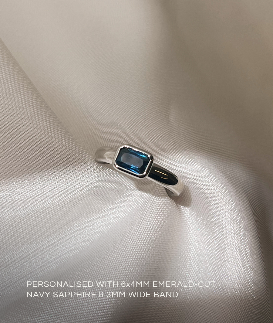East West Sapphire Emerald Solitaire