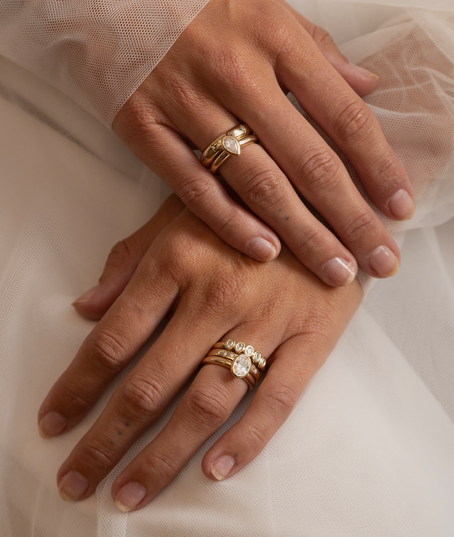 Hand carved bezel set Solitaire ring, cast in solid Gold and stacked with other minimal gold rings. Handcrafted to order in Sydney Australia. Minimal Diamond Engagement ring ideal for stacking with other bands. Custom engagement and wedding rings.