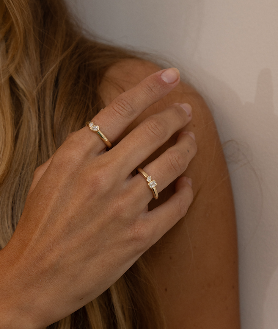 Mini Oval and Emerald Toi et Moi ring featuring bezel set oval and emerald diamonds, cast in solid Gold. Mindful jewellery and unique engagement rings for the modern woman and bride. Made in Sydney Australia 