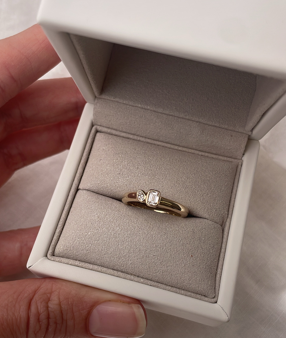 Mini Oval and Emerald Toi et Moi ring featuring bezel set oval and emerald diamonds, cast in solid Gold. Mindful jewellery and unique engagement rings for the modern woman and bride. Made in Sydney Australia 