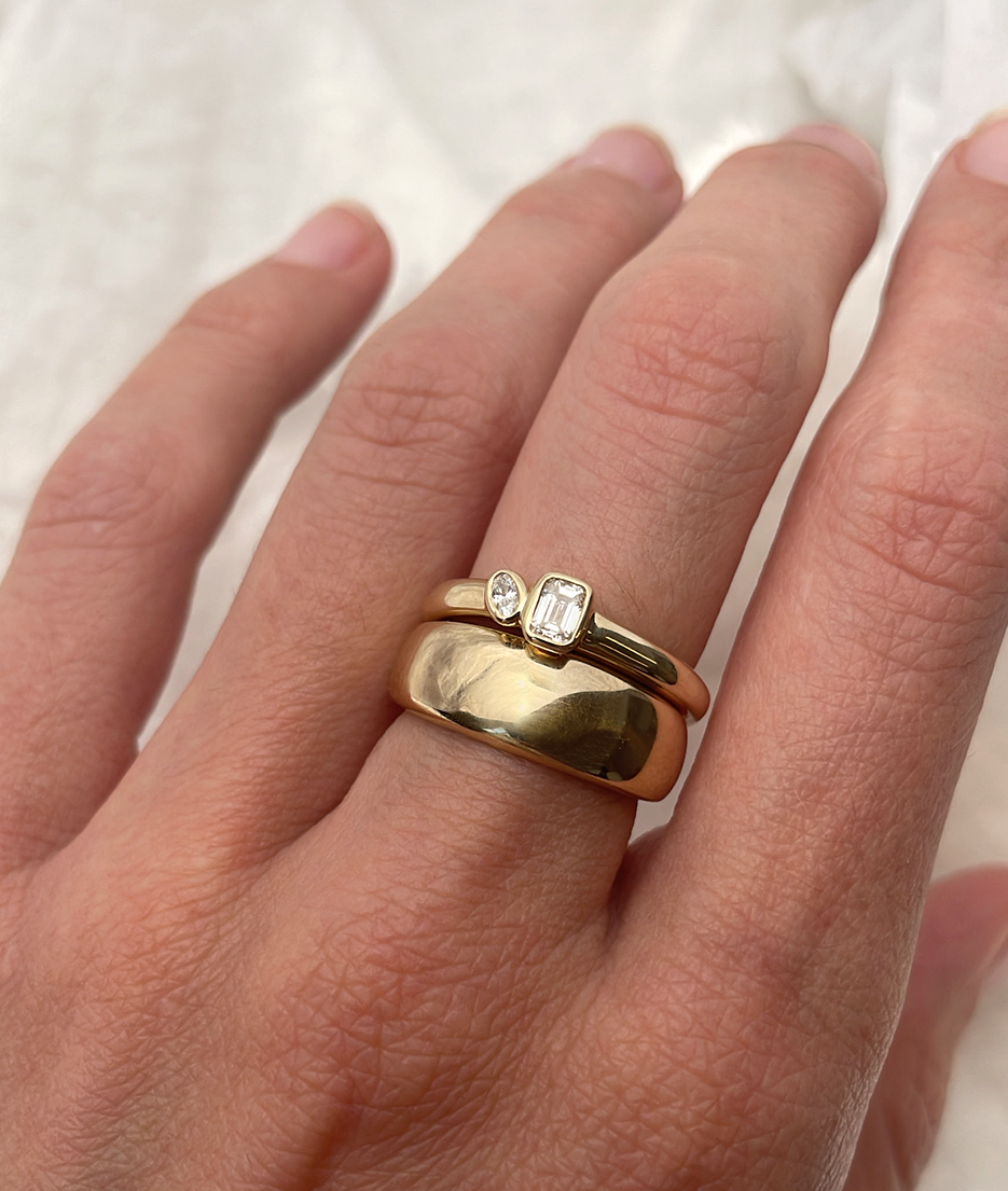Mini Oval and Emerald Toi et Moi ring featuring bezel set oval and emerald diamonds, cast in solid Gold. Mindful jewellery and unique engagement rings for the modern woman and bride. Made in Sydney Australia 