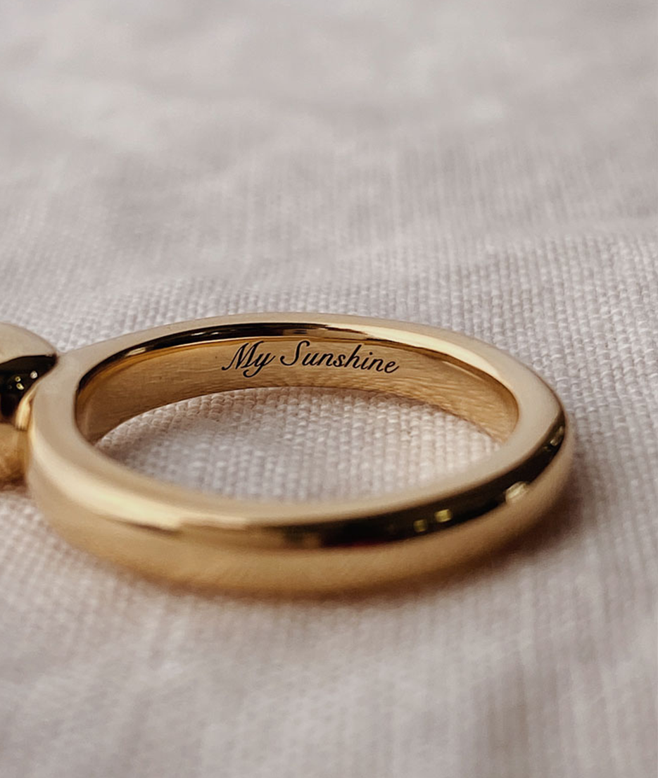Hand carved oval bezel set Solitaire ring with cursive engraving, cast in solid Gold. Handcrafted to order in Sydney Australia. Minimal Diamond Engagement ring ideal for stacking with other bands. Custom engagement and wedding rings.