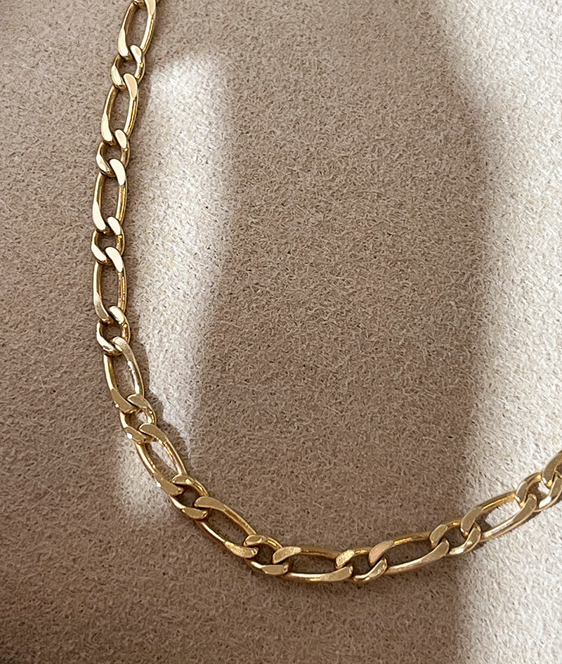 Solid Gold Figaro Chain Bracelet Close Up