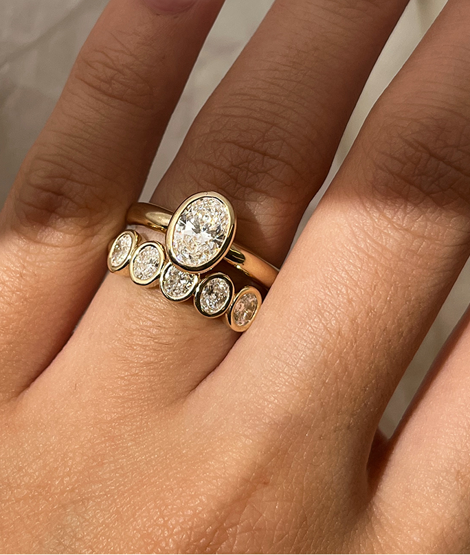 Handmade Oval Medium 5 Suns Ring in solid gold. Hand crafted to order in Sydney. Meaningful heirlooms, engagement rings and wedding bands for the Modern bride. Conscious jewellery. Paired with 0.8ct Oval Solitaire