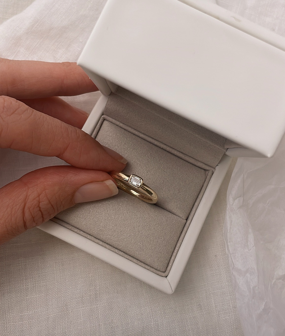 Handmade Mini Solitaire ring by RUUSK jewellery. Emerald Diamond Mini Solitaire, cast in solid Gold. Mindful jewellery and unique engagement rings for the modern woman and bride. Made in Sydney Australia