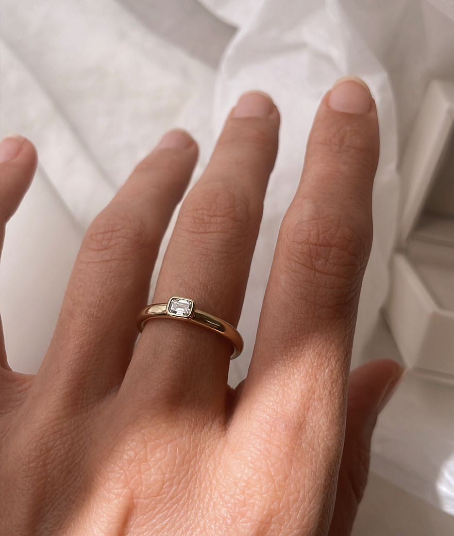 Handmade Mini Solitaire ring by RUUSK jewellery. Emerald Diamond Mini Solitaire, cast in solid Gold. Mindful jewellery and unique engagement rings for the modern woman and bride. Made in Sydney Australia