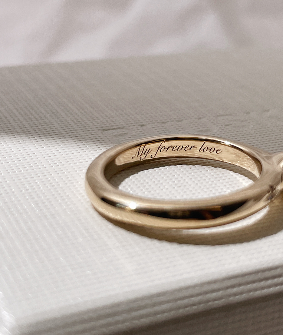 Mini Oval and Emerald Toi et Moi ring featuring bezel set oval and emerald diamonds, cast in solid Gold with engraving inside band. Mindful jewellery and unique engagement rings for the modern woman and bride. Made in Sydney Australia 