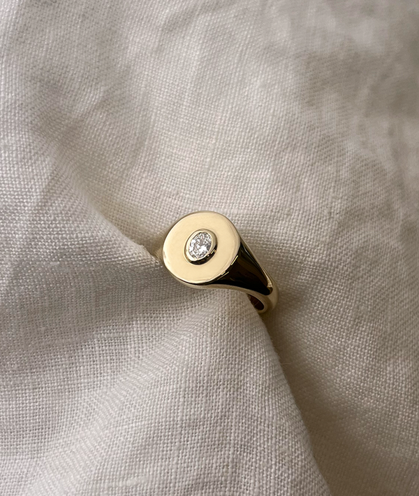 Oval Bezel-Set Small Signet Ring, cast in solid Gold. Handmade womens signet ring featuring a conflict-free Diamond. Made to order in Sydney Australia. Bespoke and Custom rings for the modern woman and bride.
