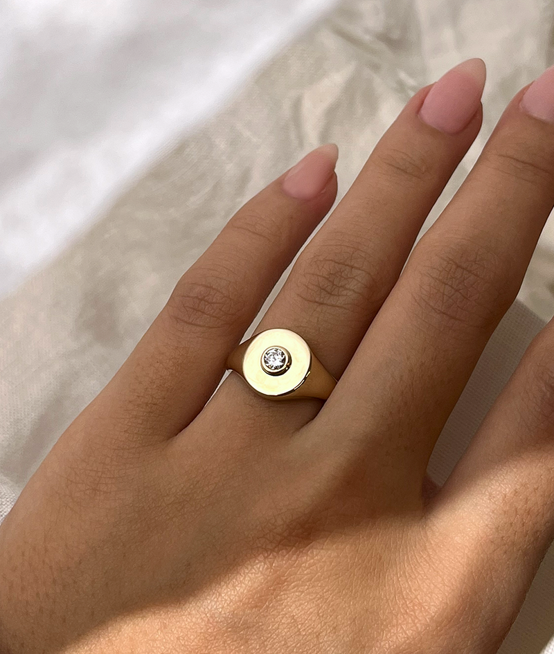 Handmade solid gold womens signet ring featuring a conflict-free Diamond. Round diamond bezel set in the centre of the signet face, cast in solid Gold. Made to order in Sydney Australia. Bespoke and Custom rings for the modern woman and bride.