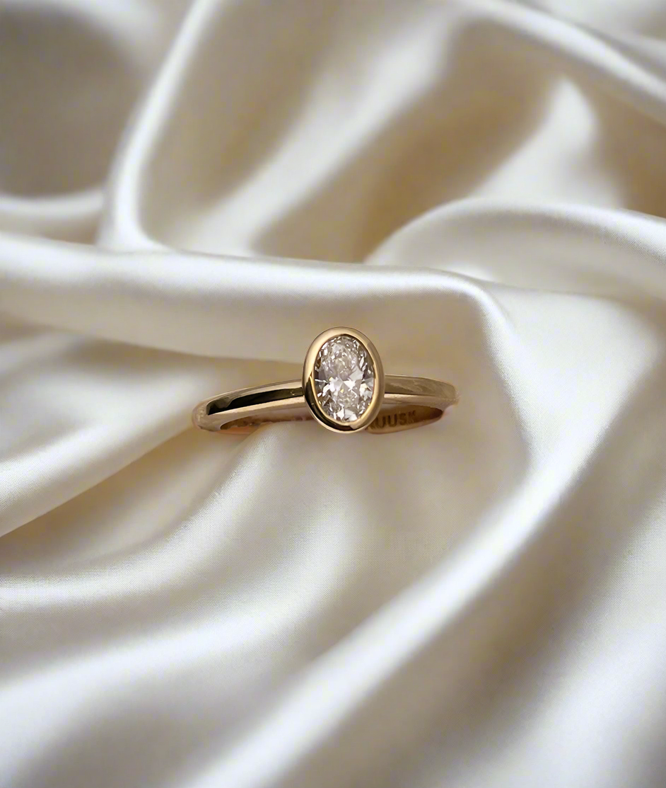 Hand carved bezel set Solitaire ring, cast in solid Gold. Handcrafted to order in Sydney Australia. Minimal Diamond Engagement ring ideal for stacking with other bands. Custom engagement and wedding rings.
