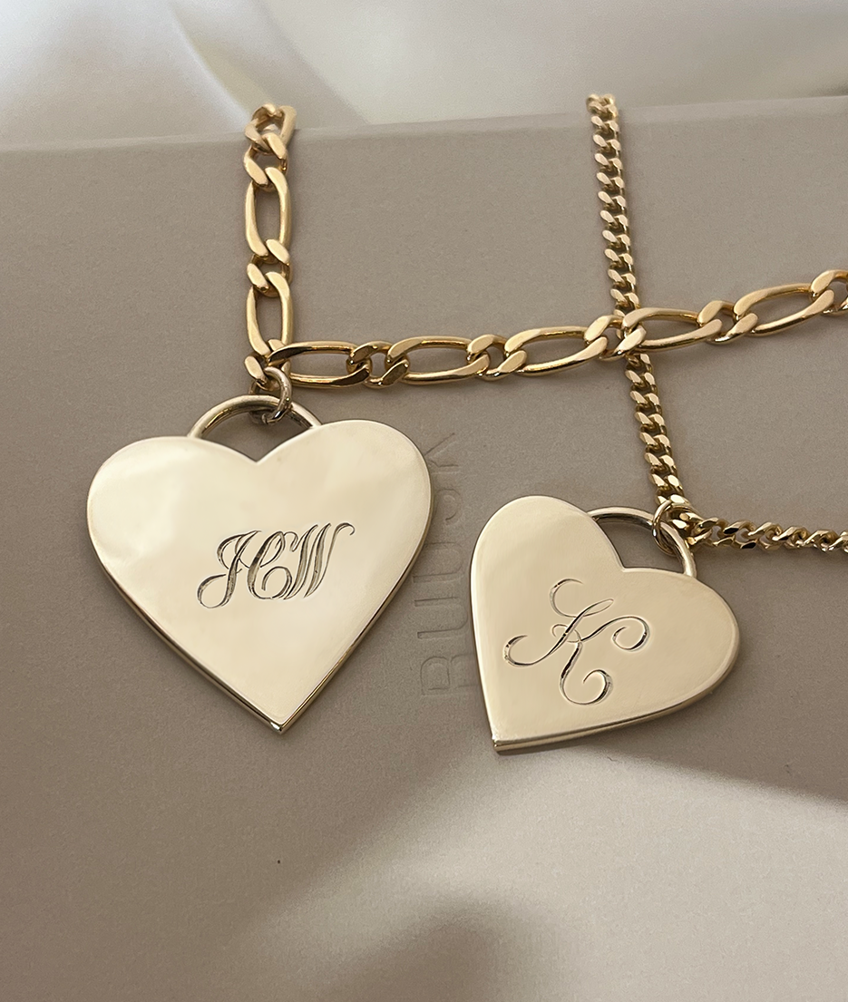 With Great Love Solid Gold Heart Pendant Necklace with hand-engraving.