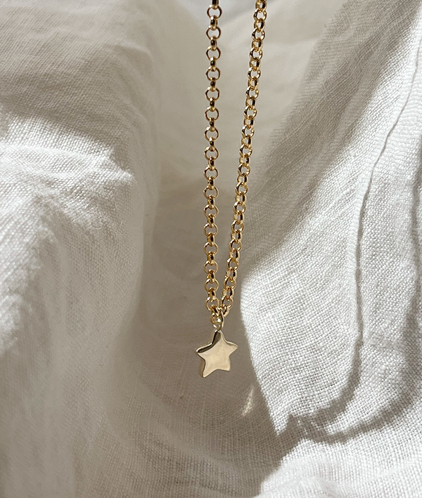 Tiny Star Charm necklace. Hand carved pendant with a flush set Diamond, Ruby, Emerald or Sapphire. Personalise your gold charm necklace with stones and engraving. Fine jewellery handmade in Sydney.