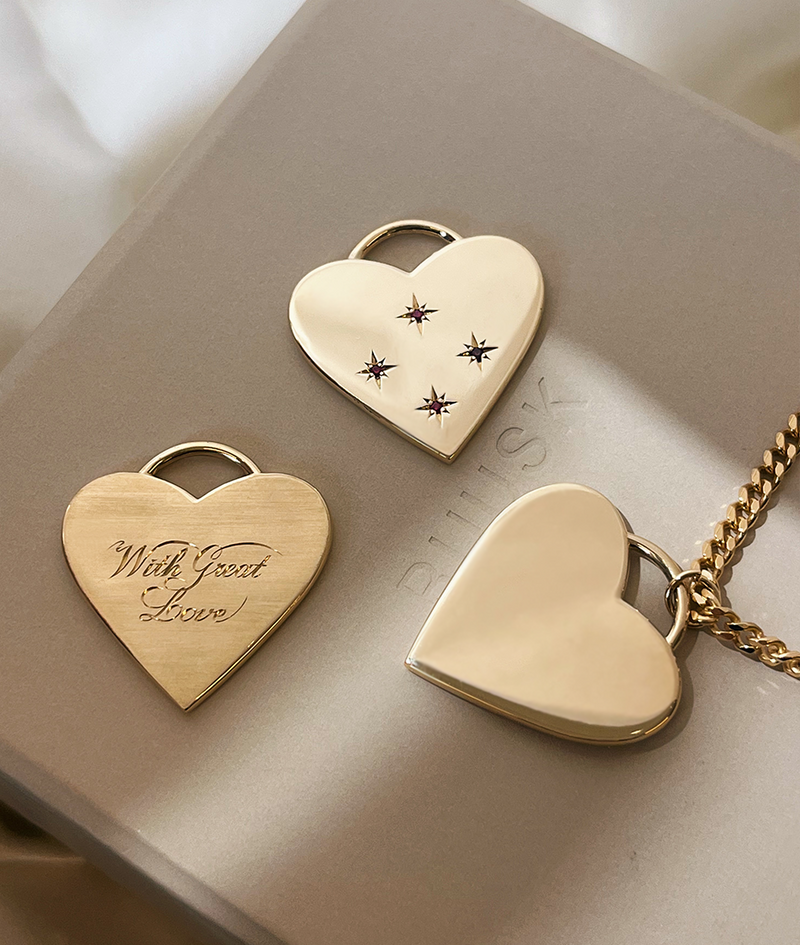 With Great Love Solid Gold Heart Pendant Necklaces. Comparing personalisation and finishing: Star-set Rubies, Hand Engraving and plain heart pendant.