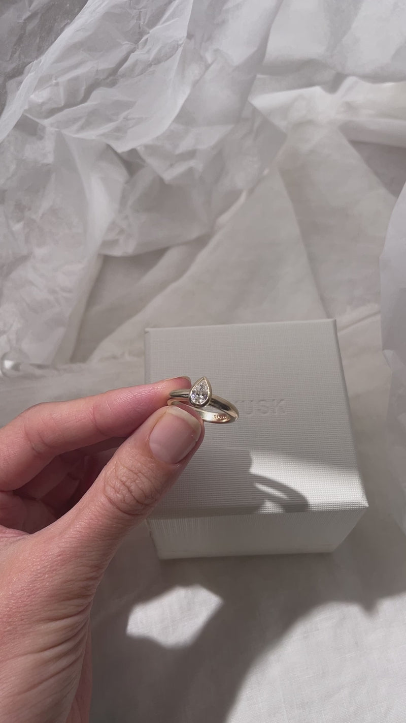 Hand carved bezel set Solitaire ring, cast in solid Gold. Handcrafted to order in Sydney Australia. Minimal Diamond Engagement ring ideal for stacking with other bands. Custom engagement and wedding rings.