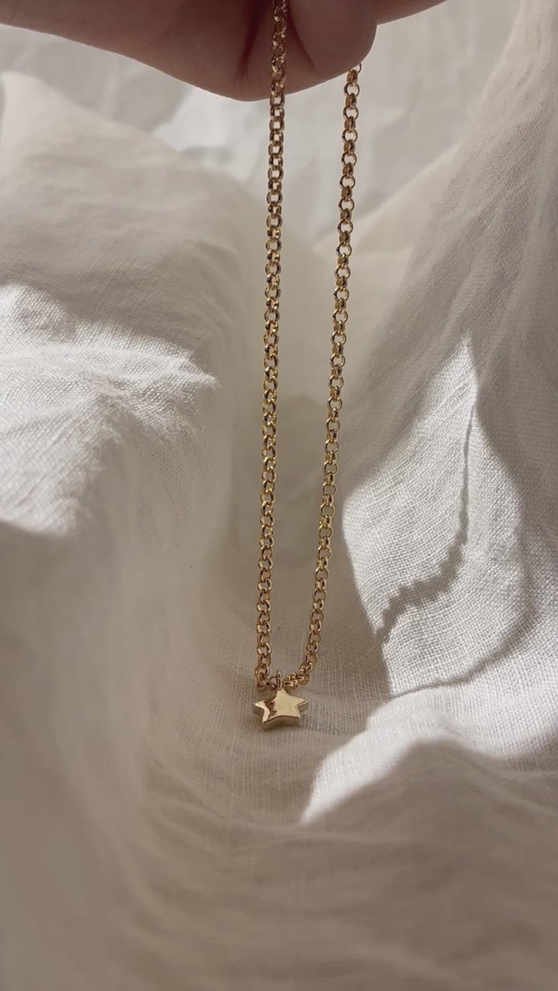 Tiny Star Charm necklace. Hand carved pendant with a flush set Diamond, Ruby, Emerald or Sapphire. Personalise your gold charm necklace with stones and engraving. Fine jewellery handmade in Sydney.