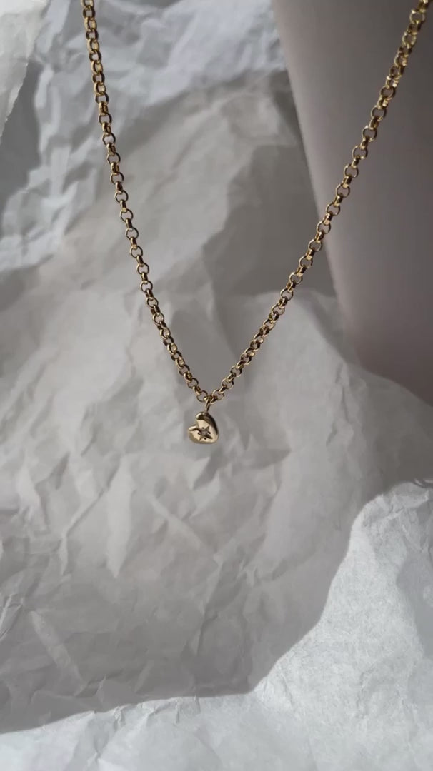 Load video: READYMADE Tiny Heart of Gold necklace
