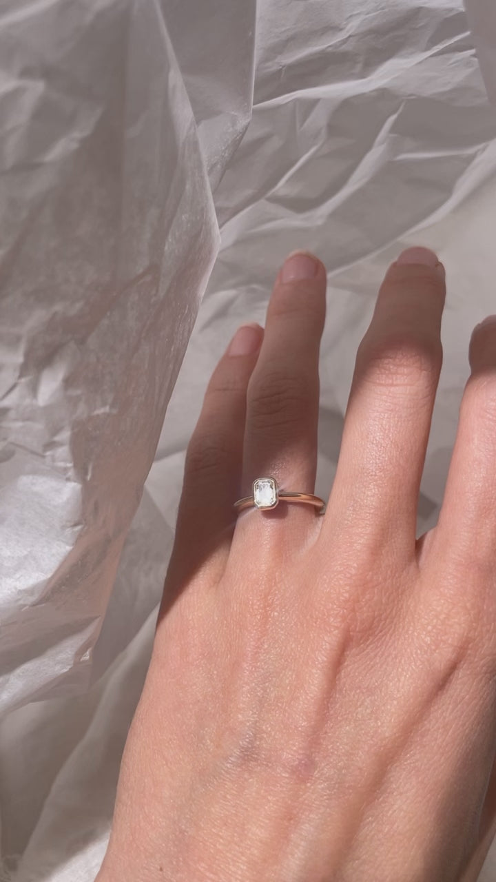 Emerald Cut Diamond bezel set Solitaire ring, cast in solid Gold. Handcrafted to order in Sydney Australia. Minimal Diamond Engagement ring ideal for stacking with other bands. Custom engagement and wedding rings.