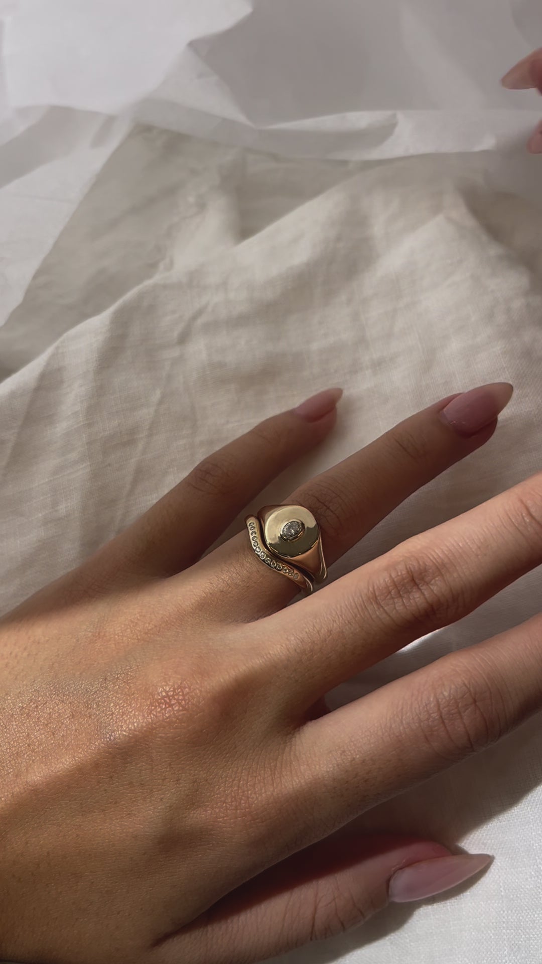 Load video: Oval Bezel-Set Small Signet Ring, cast in solid Gold. Handmade womens signet ring featuring a conflict-free Diamond. Made to order in Sydney Australia. Bespoke and Custom rings for the modern woman and bride.