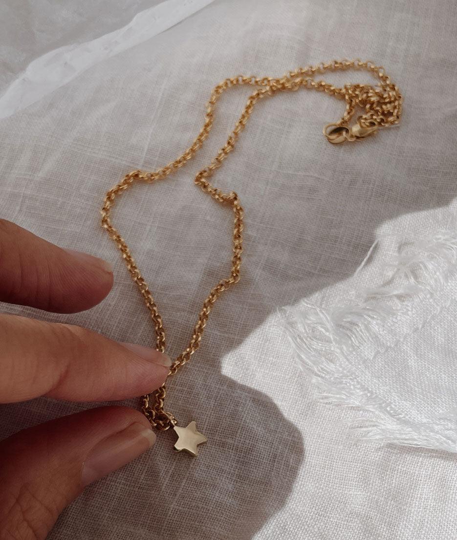 Tiny Star Charm necklace. Hand carved pendant with a flush set Diamond, Ruby, Emerald or Sapphire. Personalise your gold charm necklace with stones and engraving. Fine jewellery handmade in Sydney.